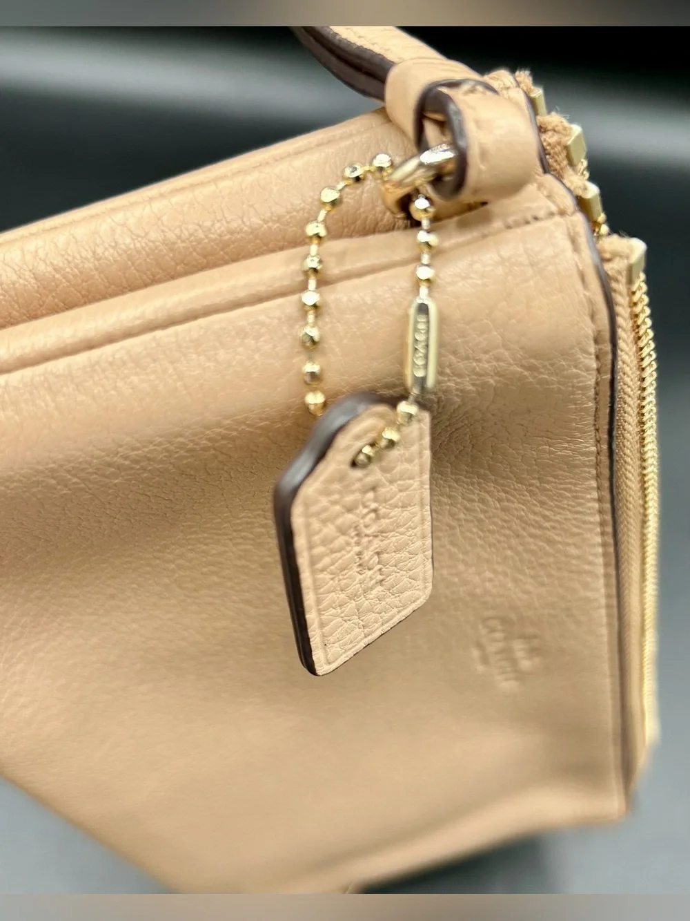 COACH Pebble Leather Double - Zip Wristlet in a neutral tan - Gold-Tone Hardware